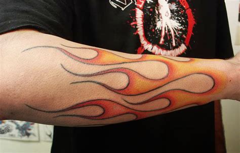 flames on forearm tattoos|purple flame sleeve tattoo.